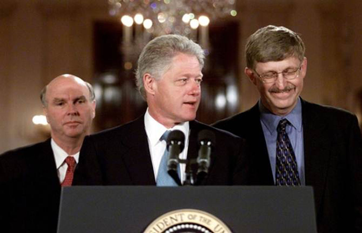 Francis Collins, M.D., Ph.D., now director of the NIH, stands to the right of then-President Bill Clinton (J. Craig Ventner, Ph.D., left) at the announcement that an international consortuim had completed the first "working draft" of the human genome on June 26, 2000.