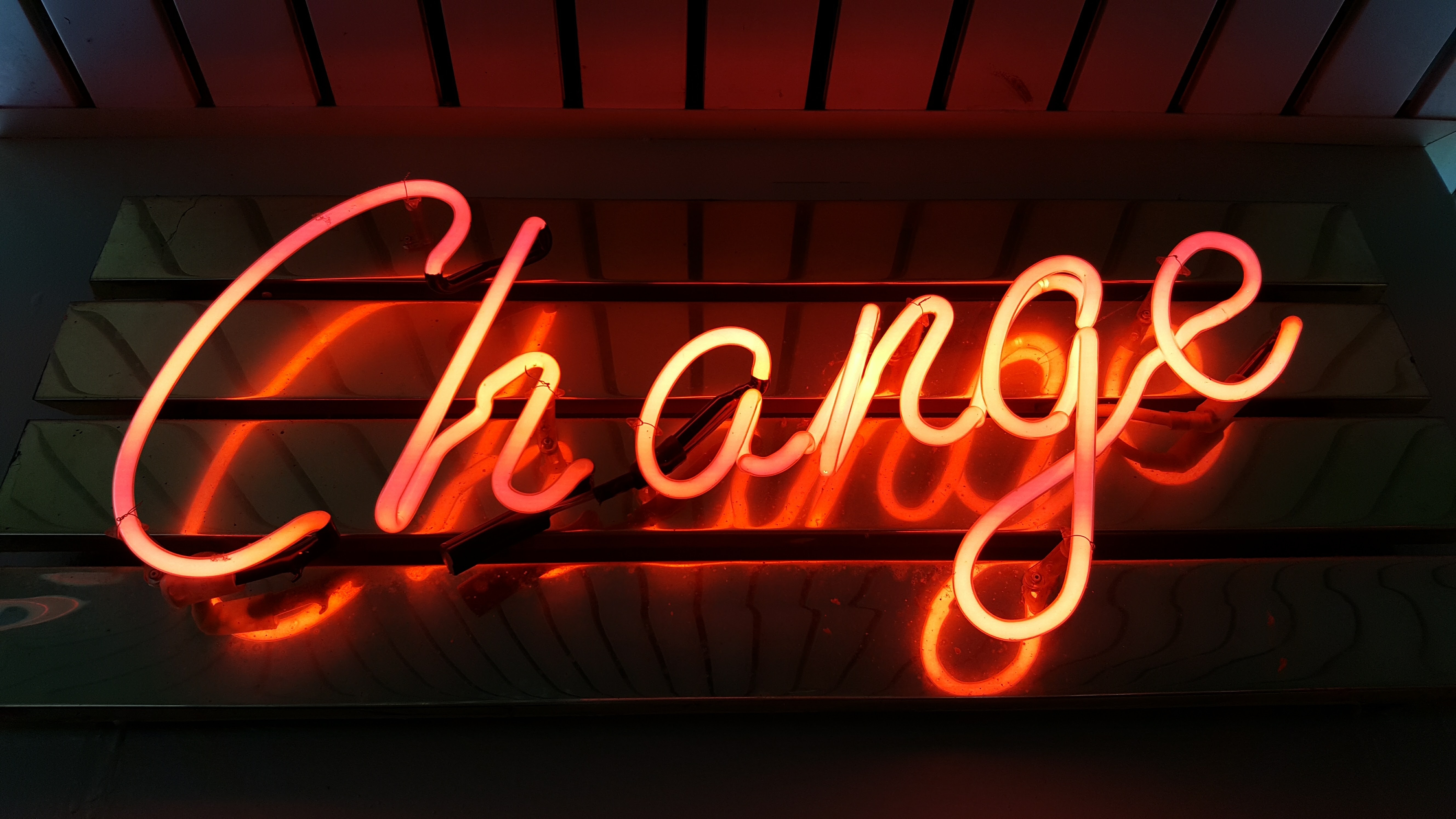 Fluorescent marquee saying "Change"