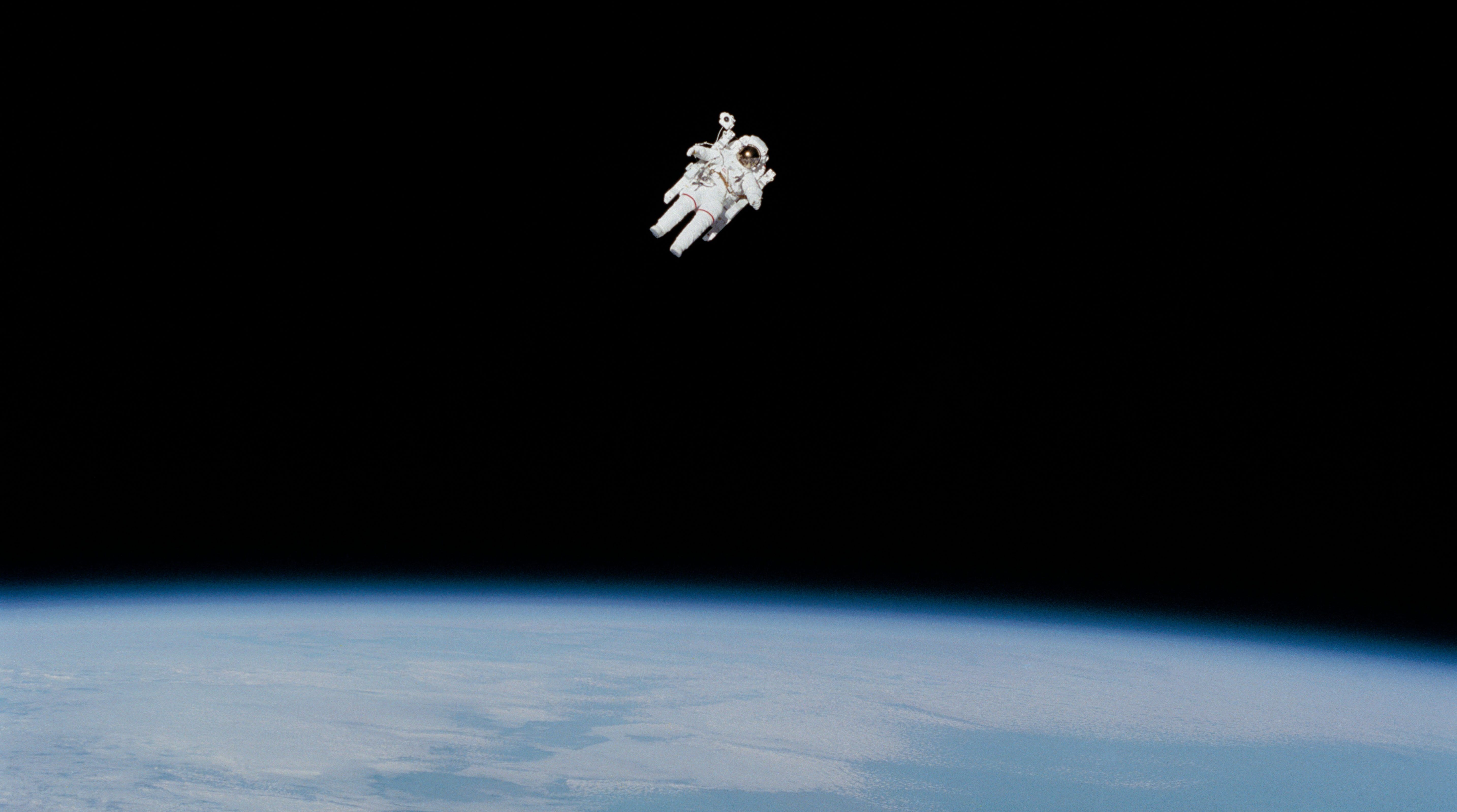 An astronaut space walking