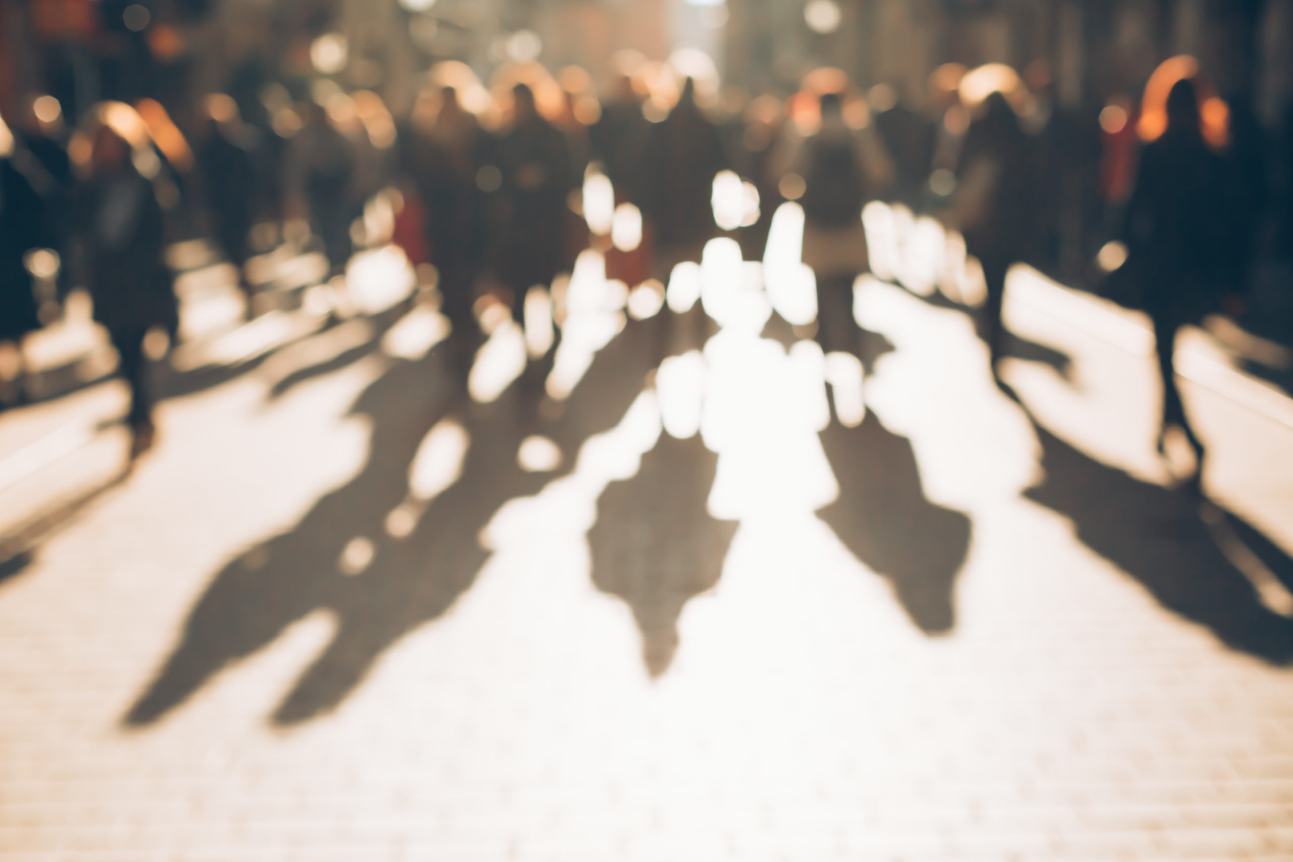 Blurred background made of people walking through the city