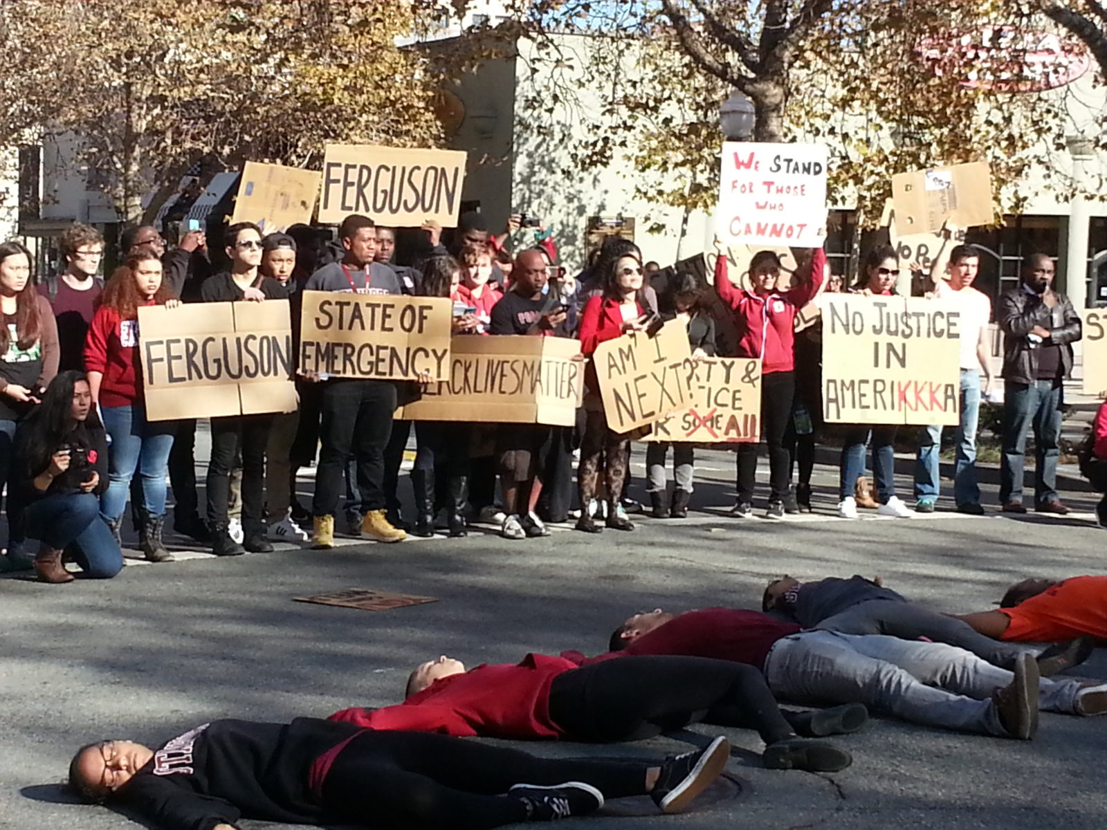 About 300 Stanford students converged on downtown Palo Alto today and briefly shut down University Avenue with a die-in, to protest the unjust decision in Ferguson.