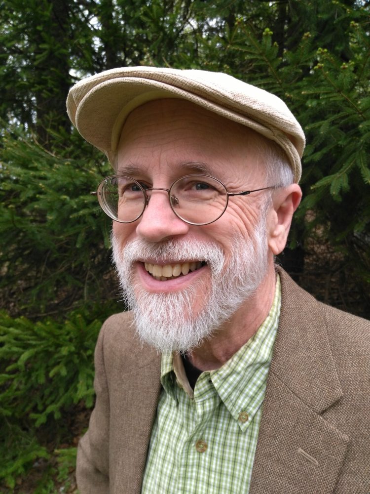 Bespectacled Michael Behe in Green Shirt, Coat, and Cap