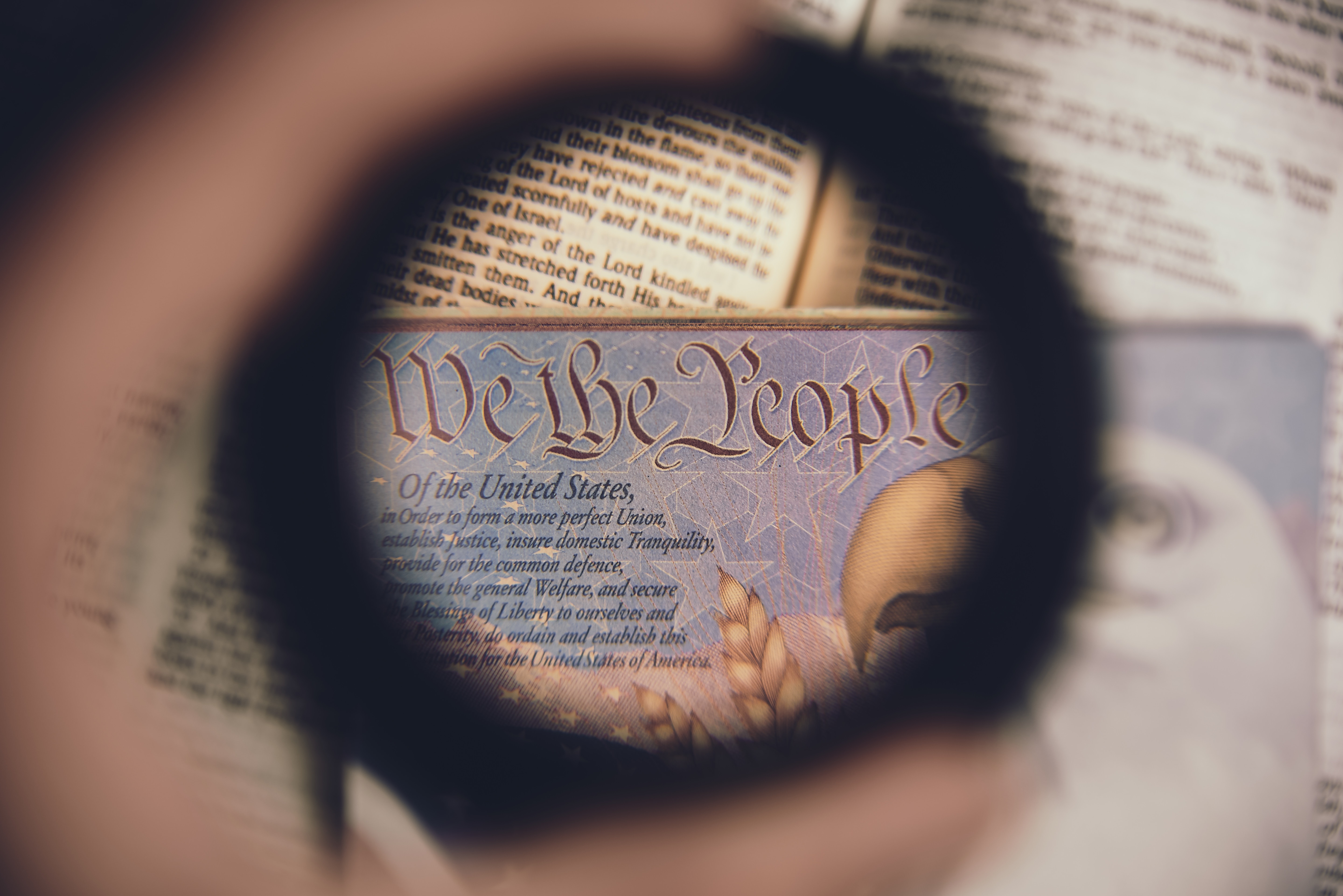 Magnifying lens (loupe) looking at