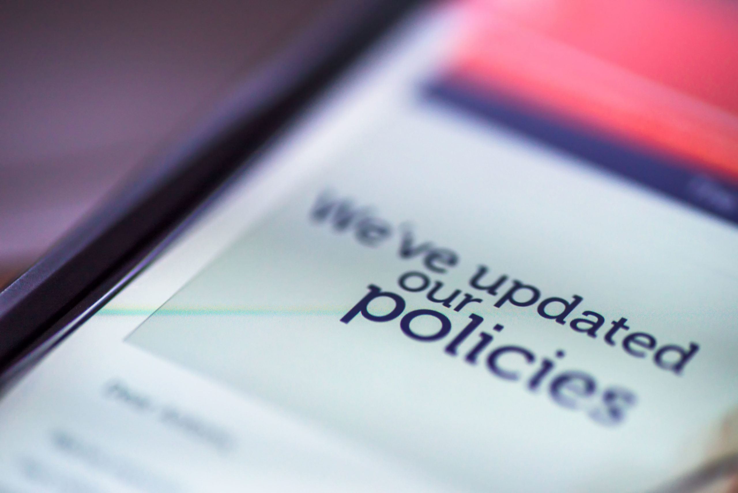 General Data Protection Regulation - GDPR - closeup smartphone message We've Updated Our Policies
