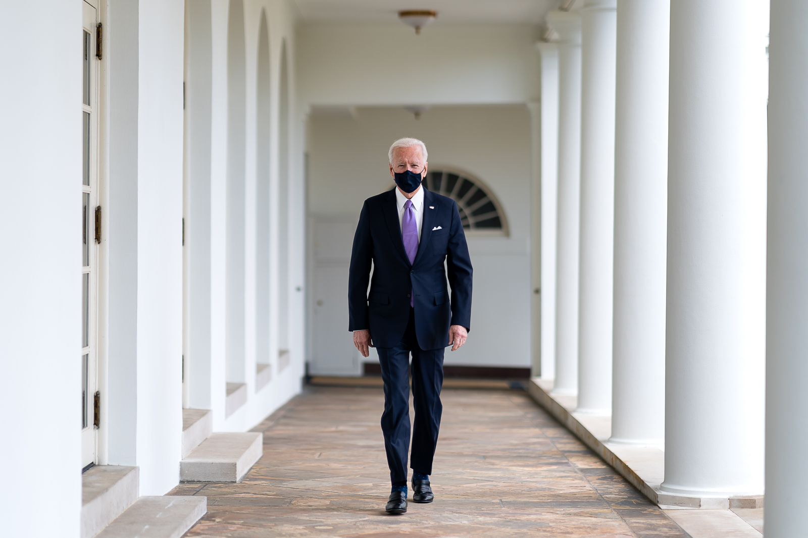 P20210121AS-0485: President Joe Biden walks along the Colonnade Thursday, Jan. 21, 2021, to the Oval Office of the White House. (Official White House Photo by Adam Schultz)