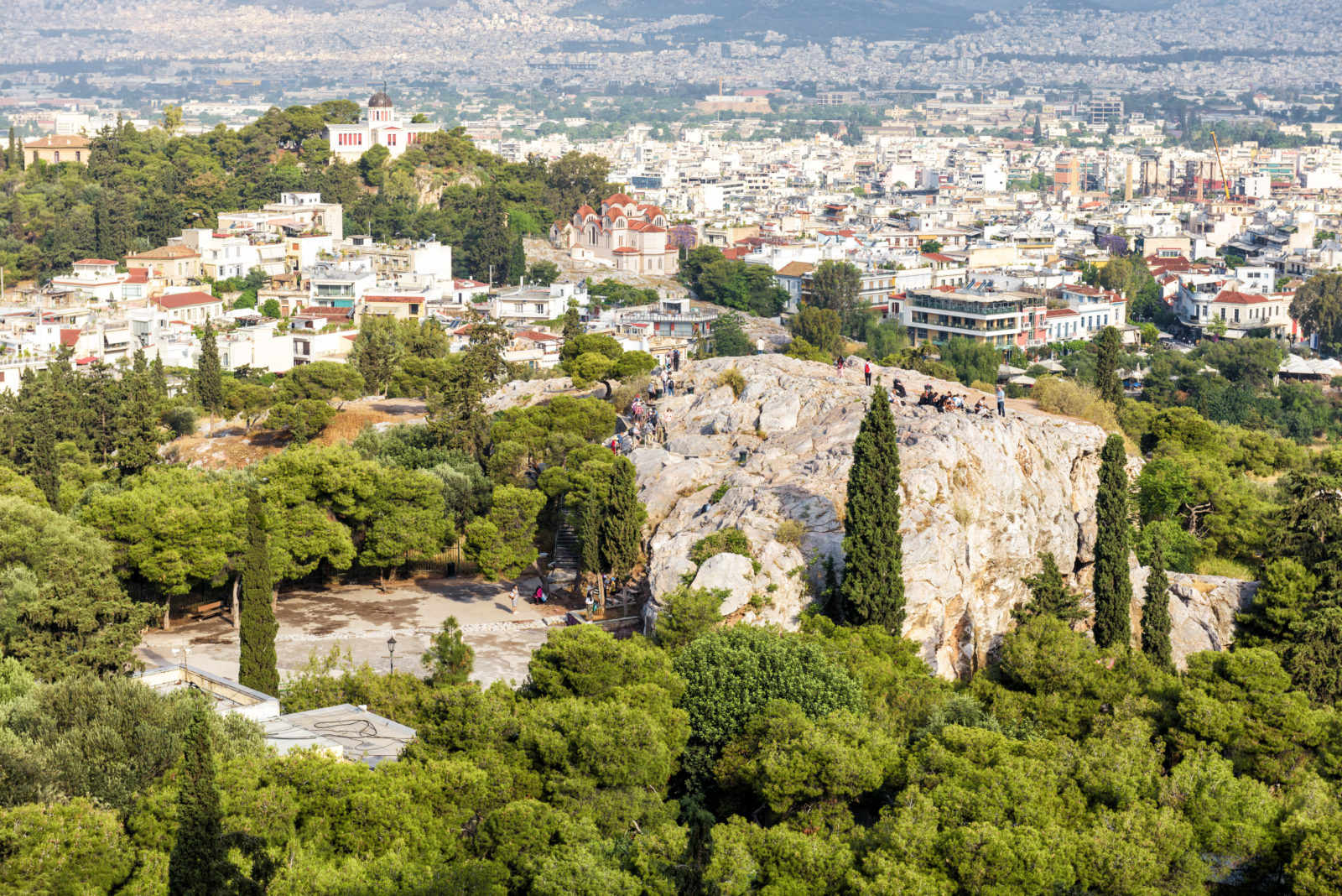 Scenic view of Areopagus rock in Athens, Greece. City skyline in summer.