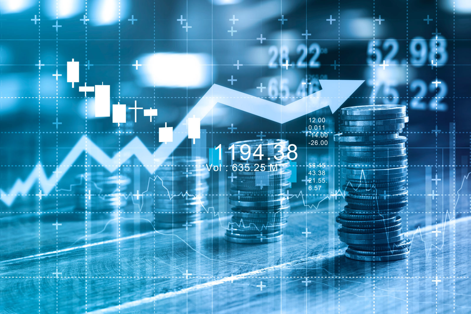 Finance and business concept. Investment graph and rows growth of coins on table, blue color tone.