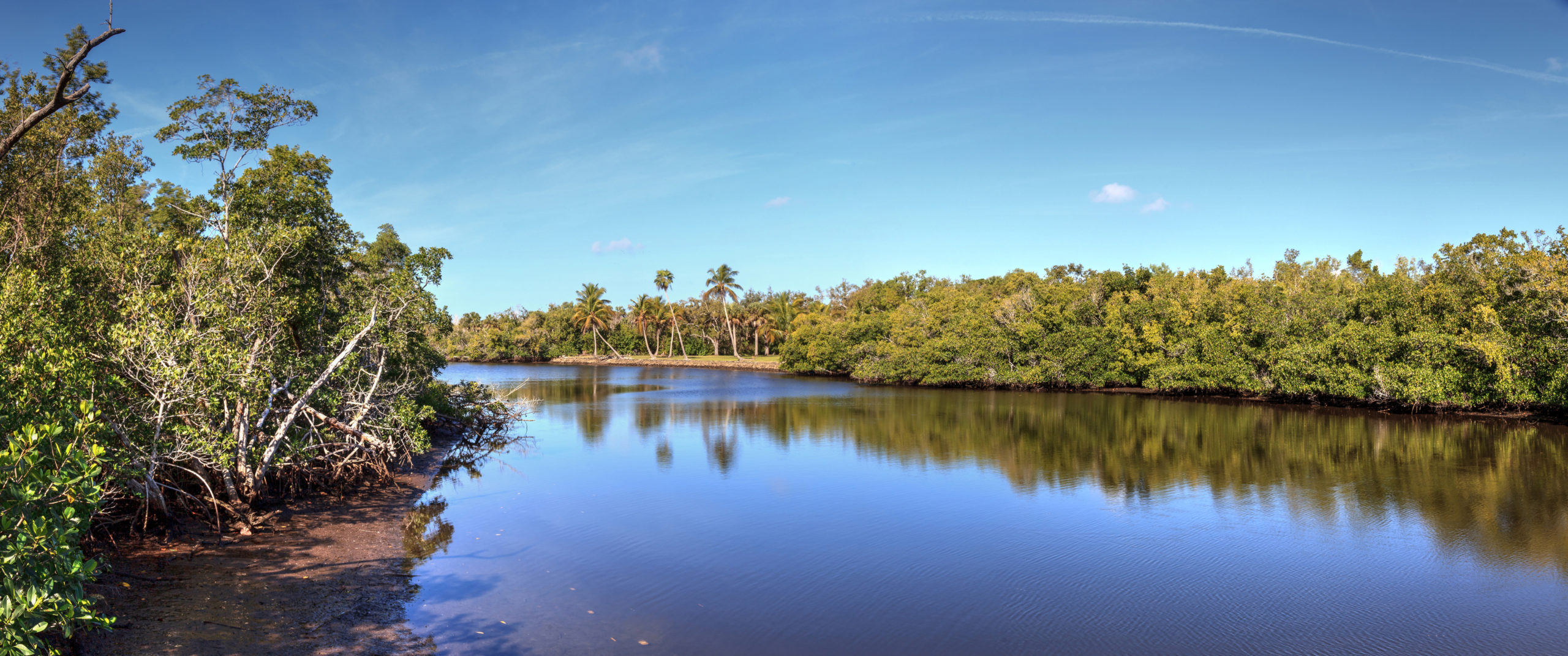 Blue sky and clouds over Henderson Creek, which runs through Rookery Bay in Marco Island