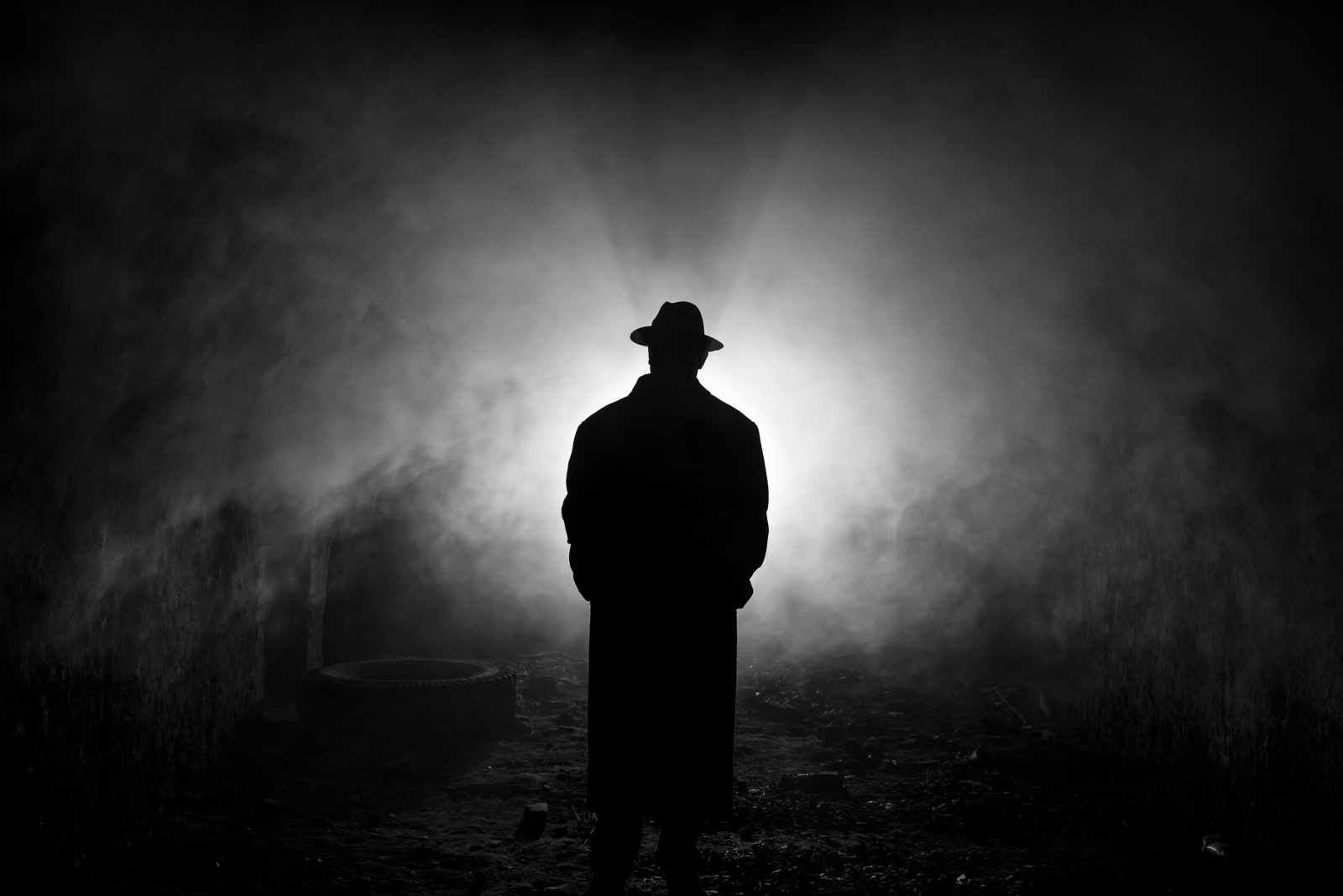 Backlight Silhouette of a Man in the Smoke