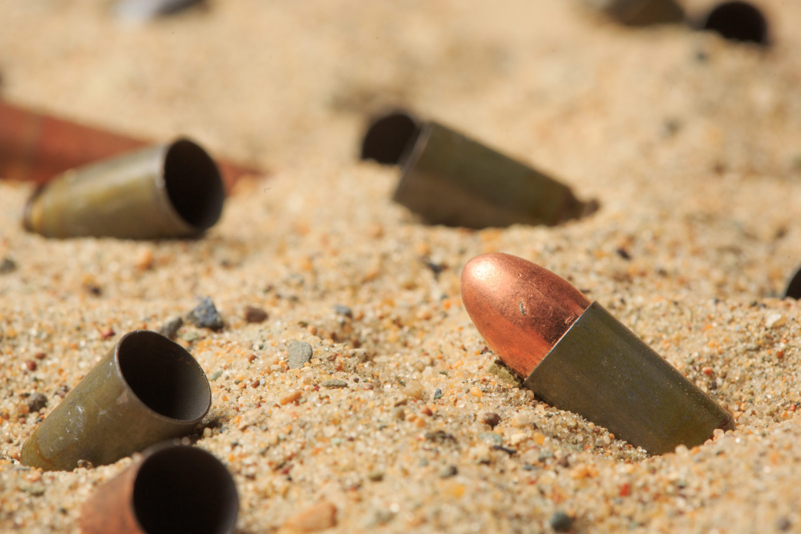 cartridge cases on the sand.