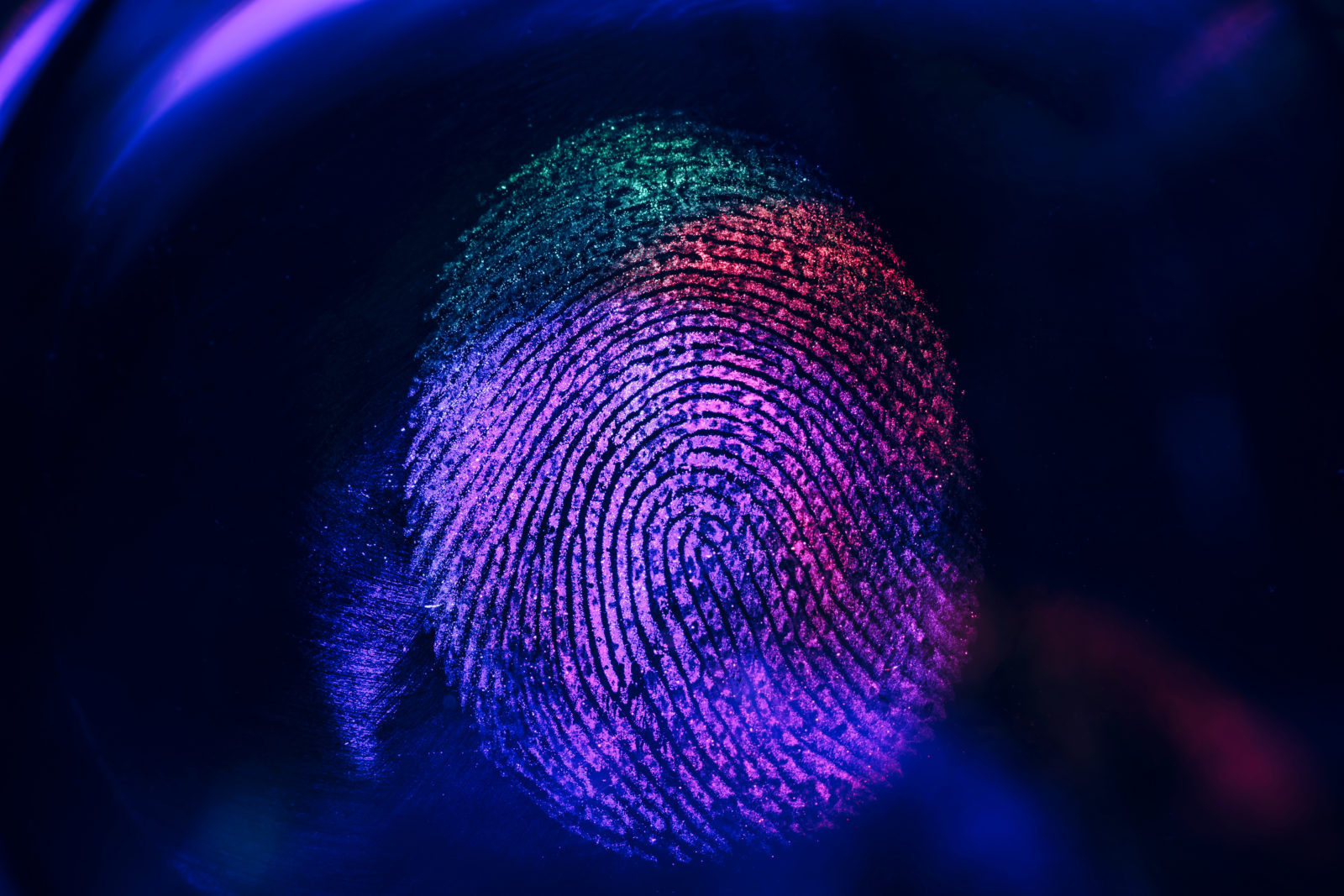 Close up beautiful abstract neon colored fingerprint on  background texture for design. Macro photography view.