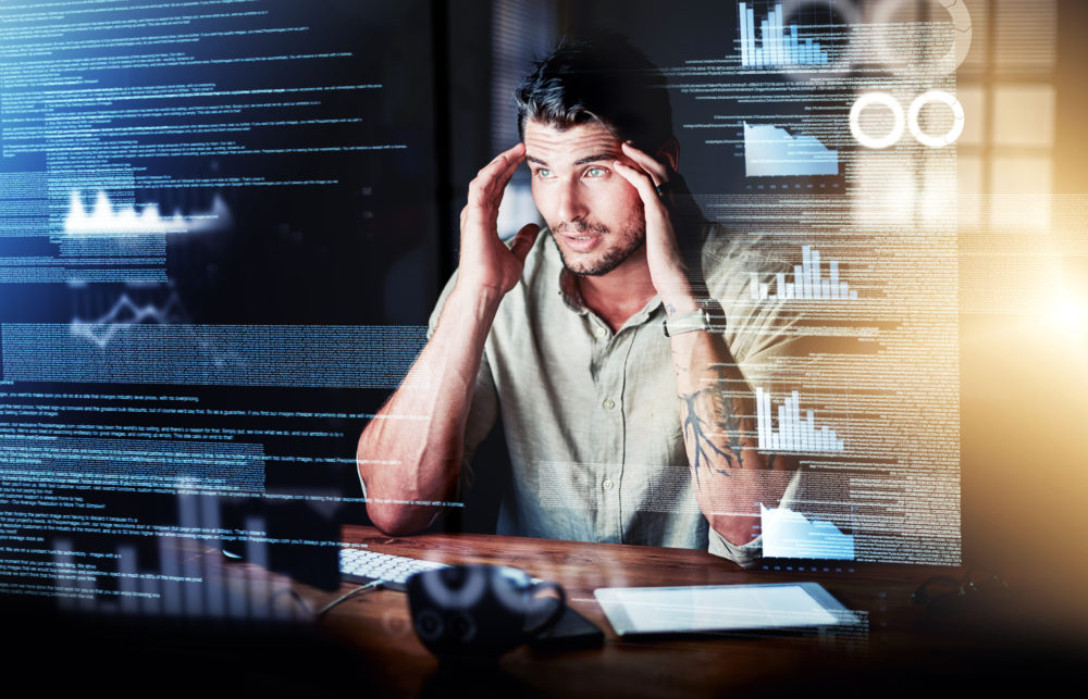 Stressed computer engineer reading code, cgi data and making mistake while analyzing special effects charts while working late at night. Confused, worried and anxious web developer discovering a hack