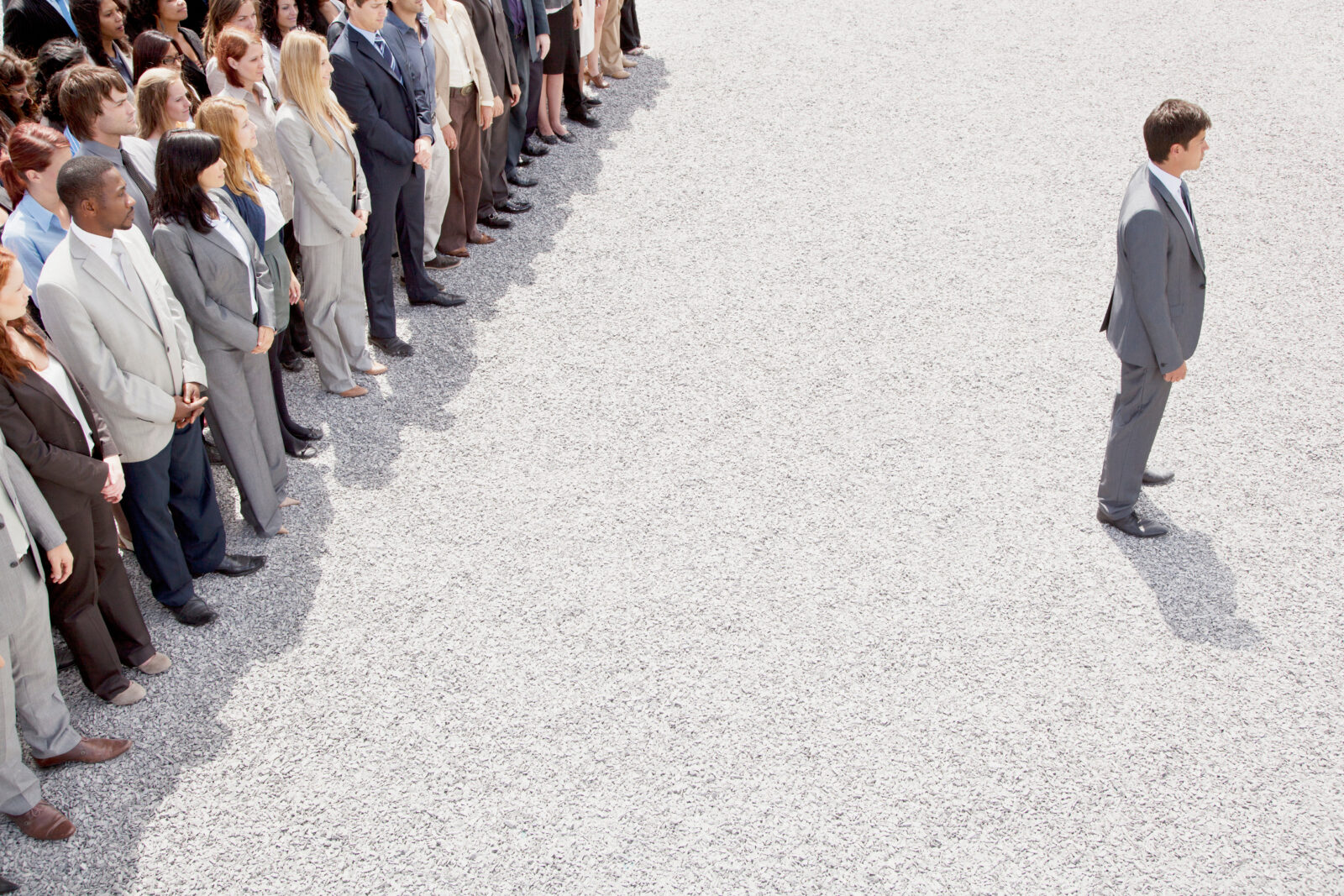 Businessman with back turned on crowd