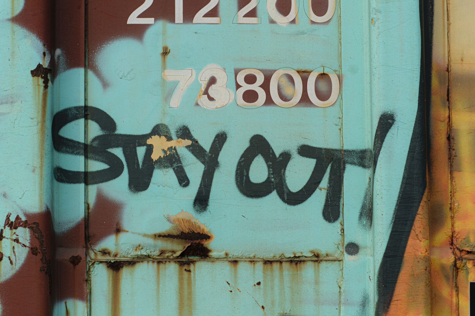 stay out painted on a train wagon