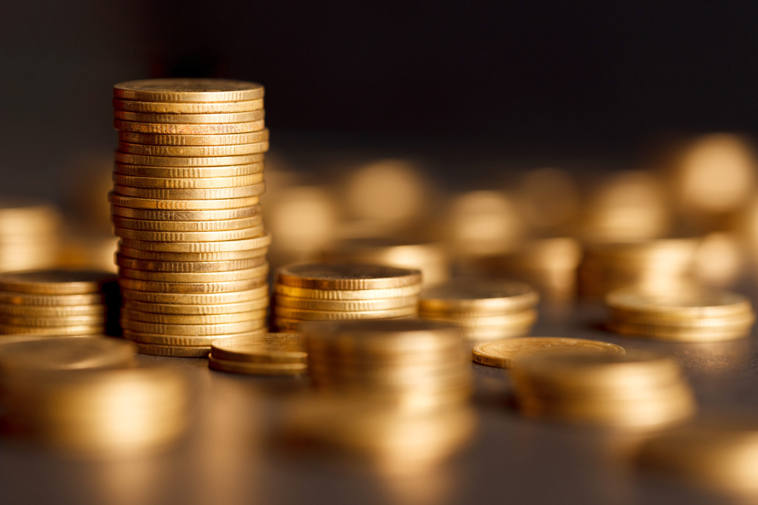 Stack of Gold Coin on Black Background.