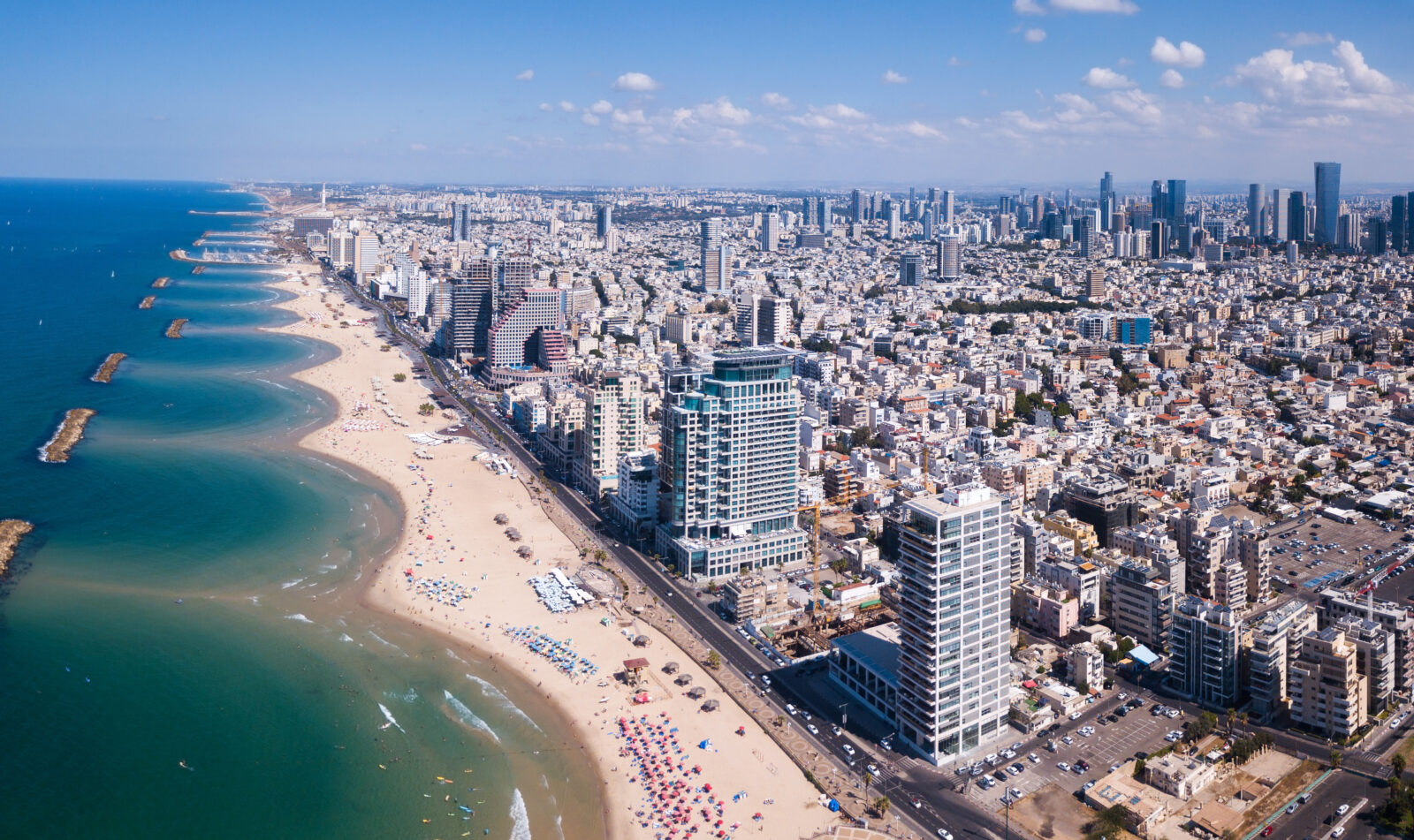 Tel Aviv skyline off the shore of the Mediterranean sea - Panoramic aerial image