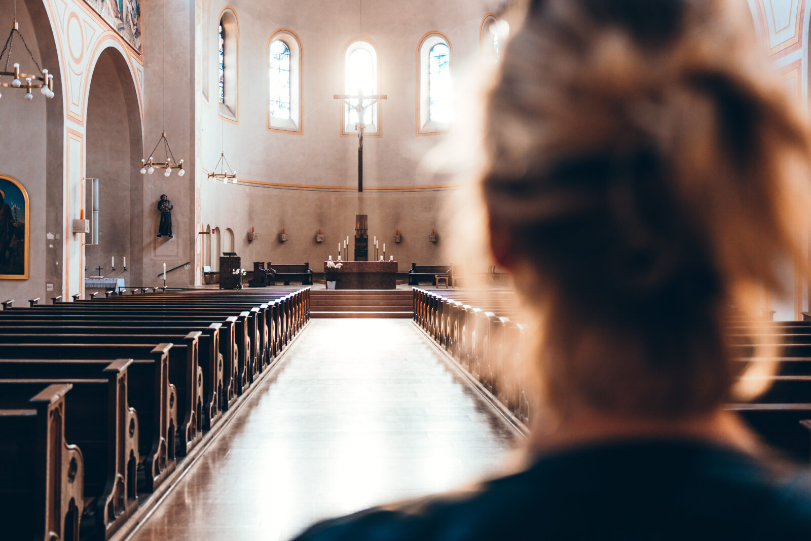 Woman in church heading to altar