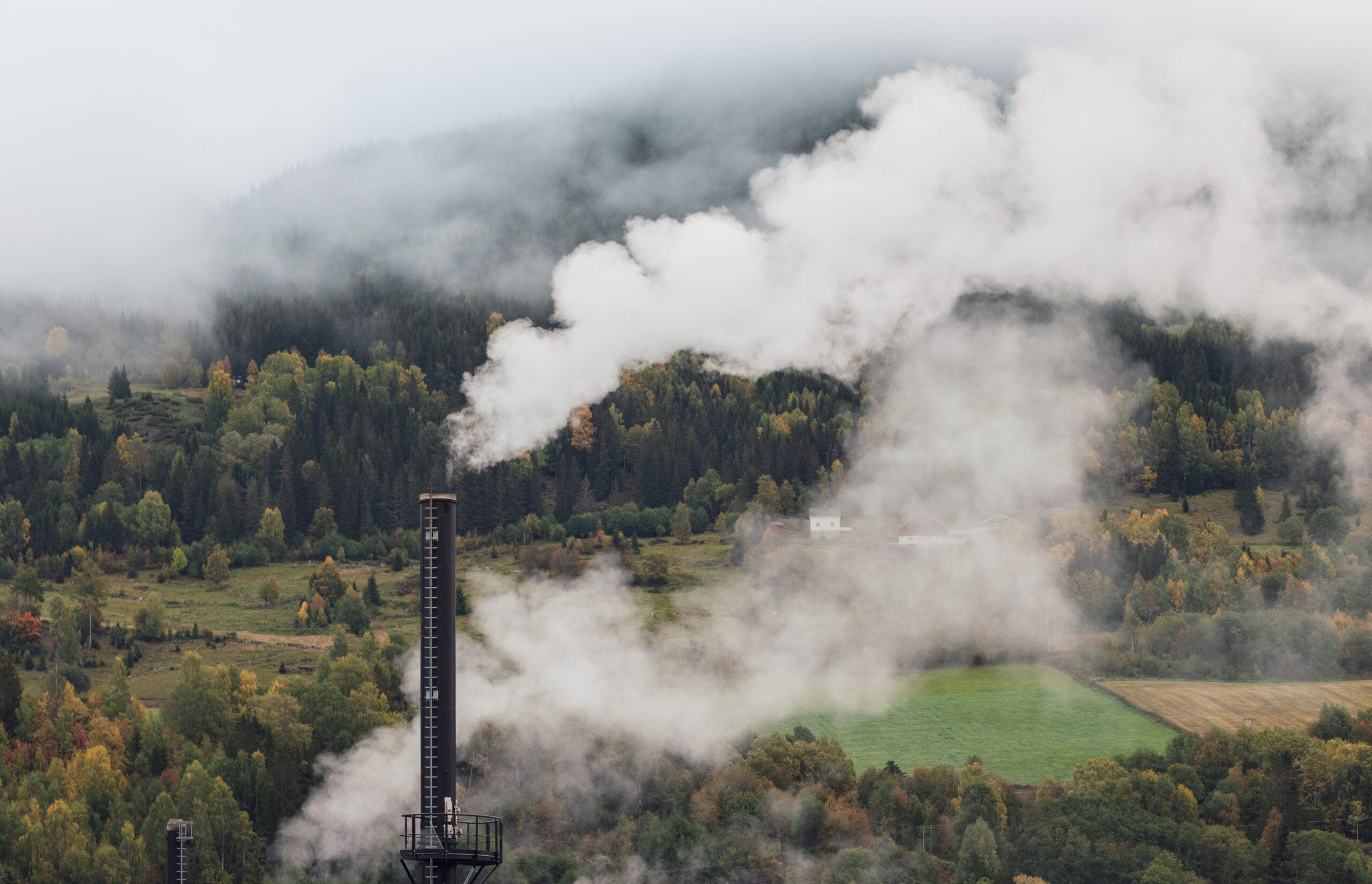 Smoke from factory chimney. Pollution and carbon capture technology concept.
