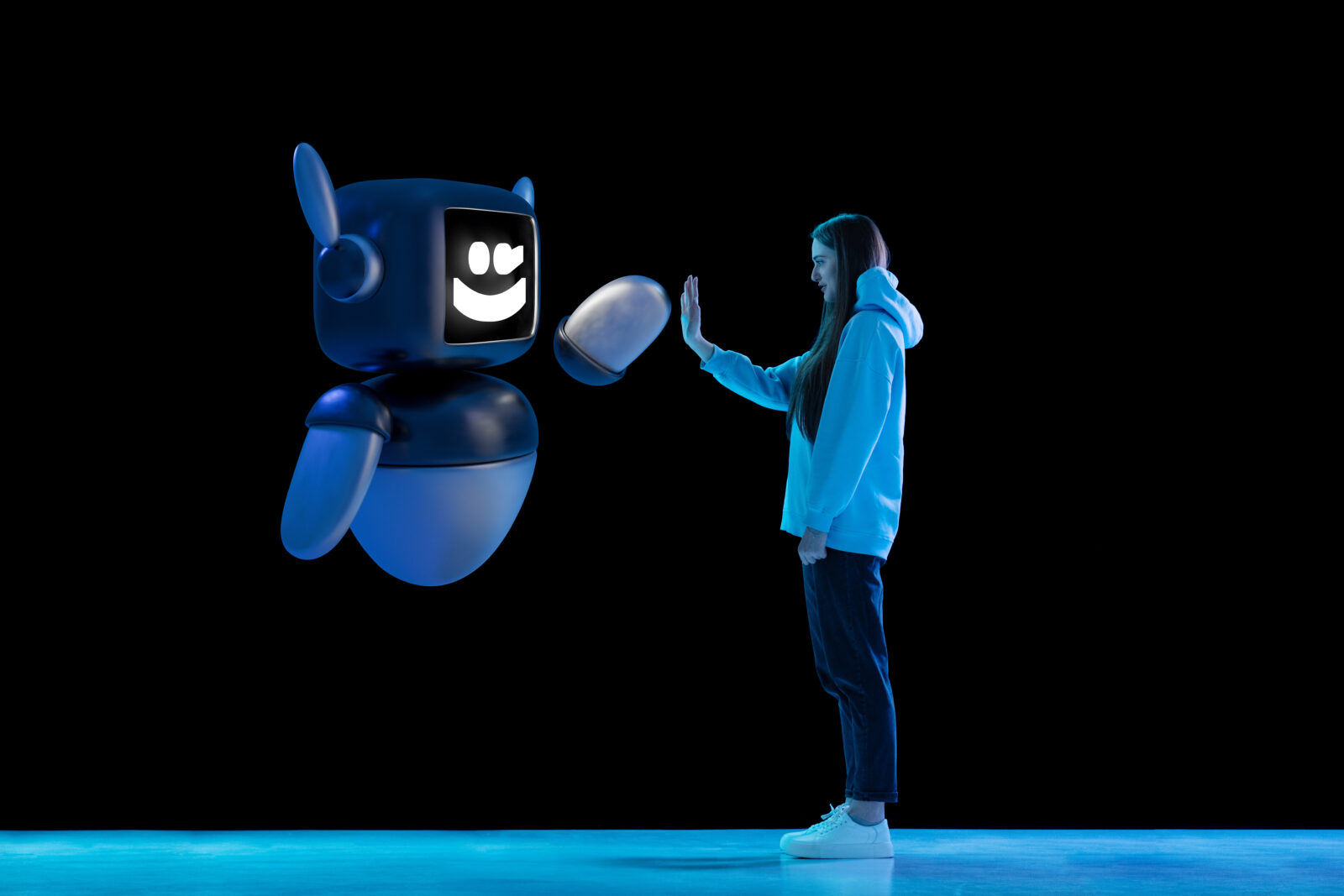 Composite image of young woman interacting with 3D model of robot, giving high five. Friendship and trust in future tech. Concept of innovation, technologies, human and robots, futurism