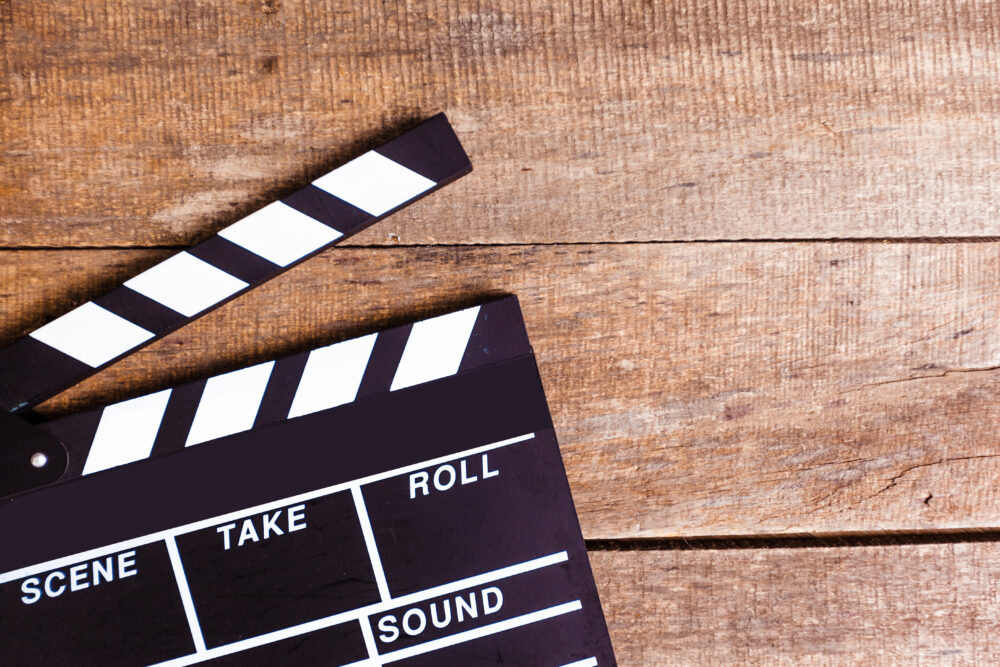 photo of movie clapper on wood