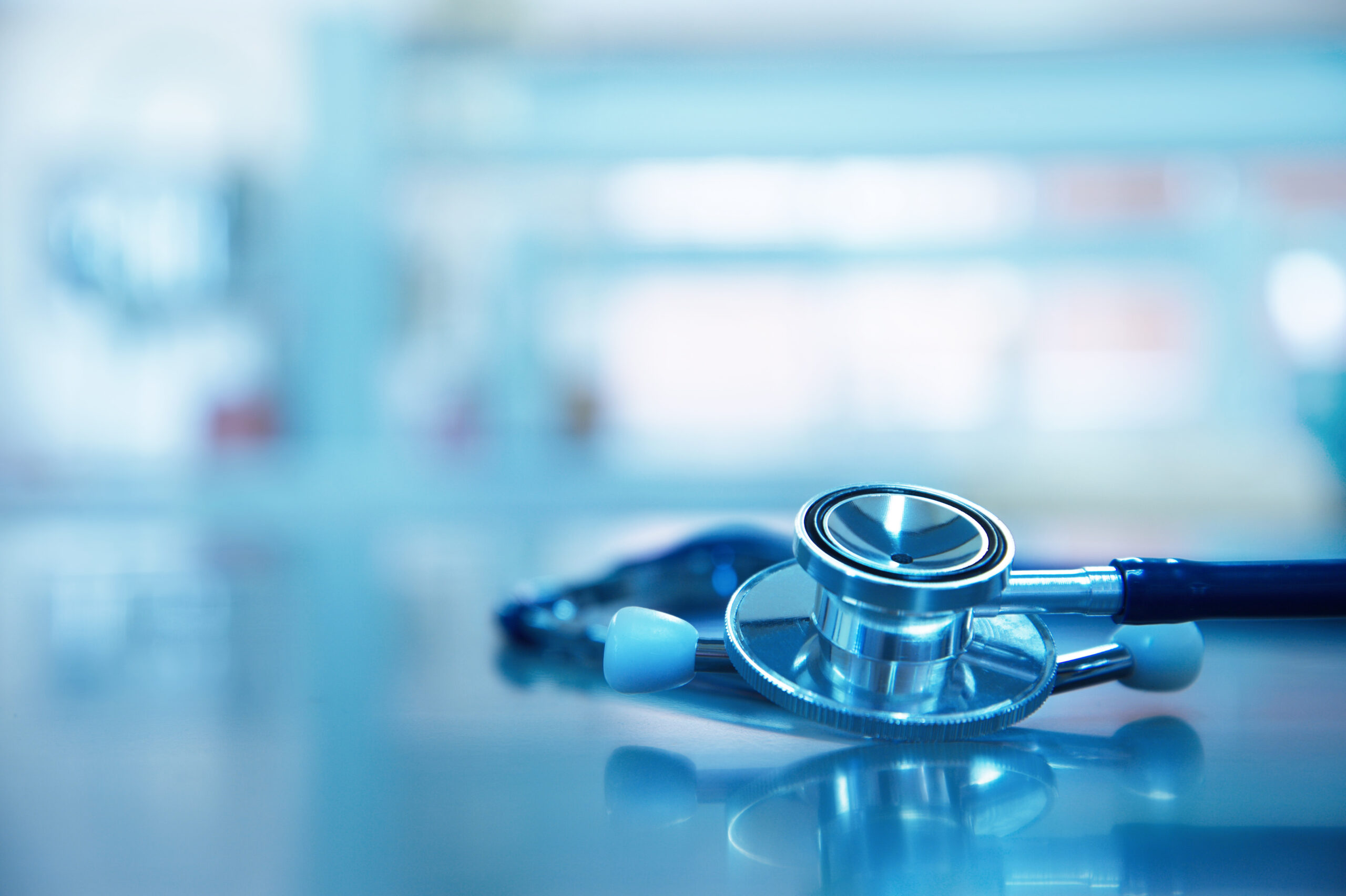 stethoscope for medical doctor diagnosis on blue health science laboratory background