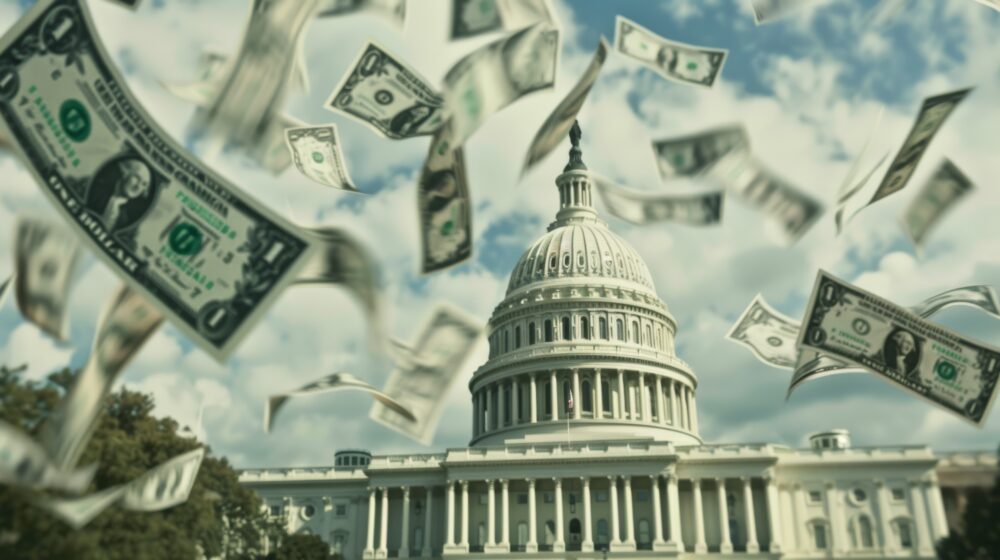 US dollar bills floating in front of the Capitol building, creating a metaphorical image about politics, money, and power.