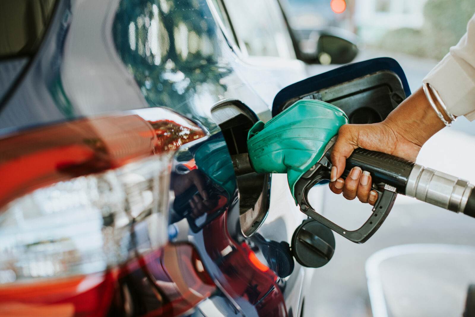 Man filling up gas in his car