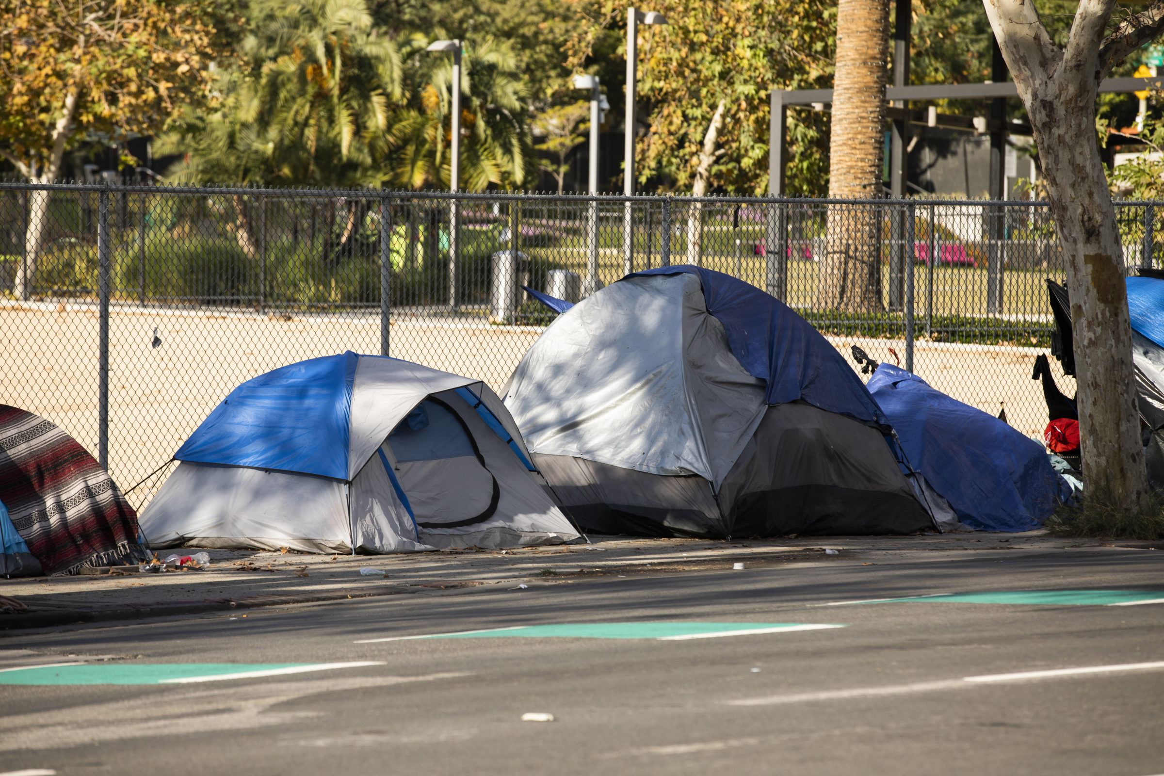 A homeless encampment sits on a street in Downtown Los Angeles, California, USA.