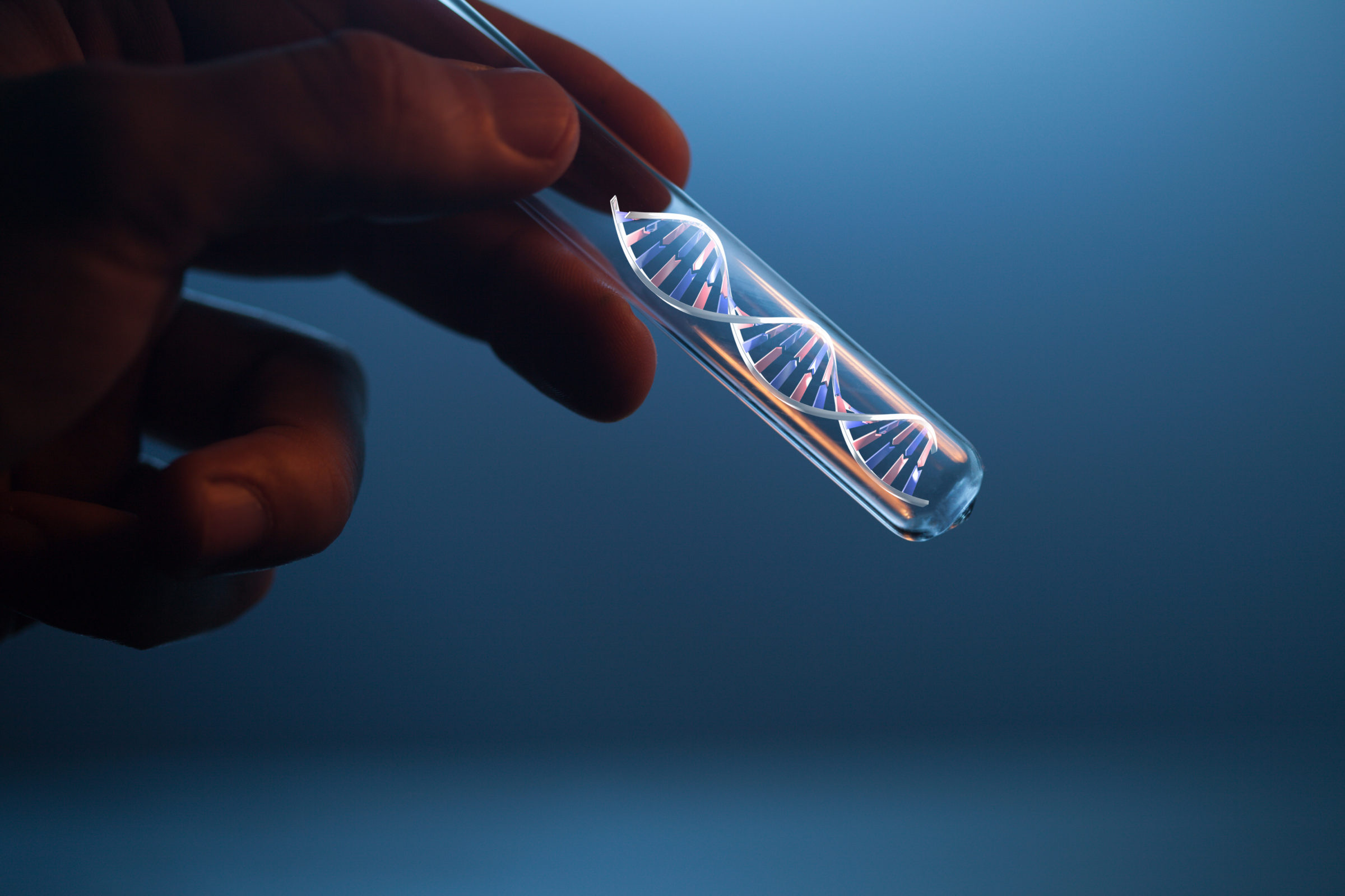 DNA molecule in glass tube in hand of scientist