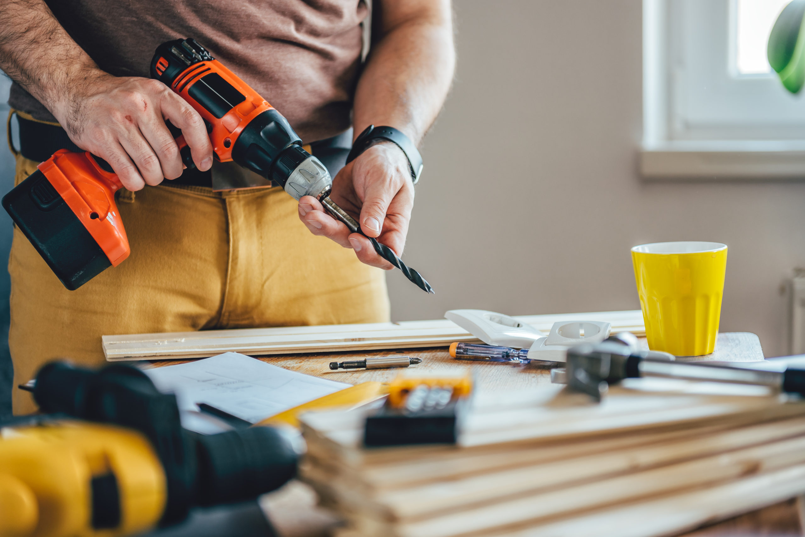 Man using cordless drill