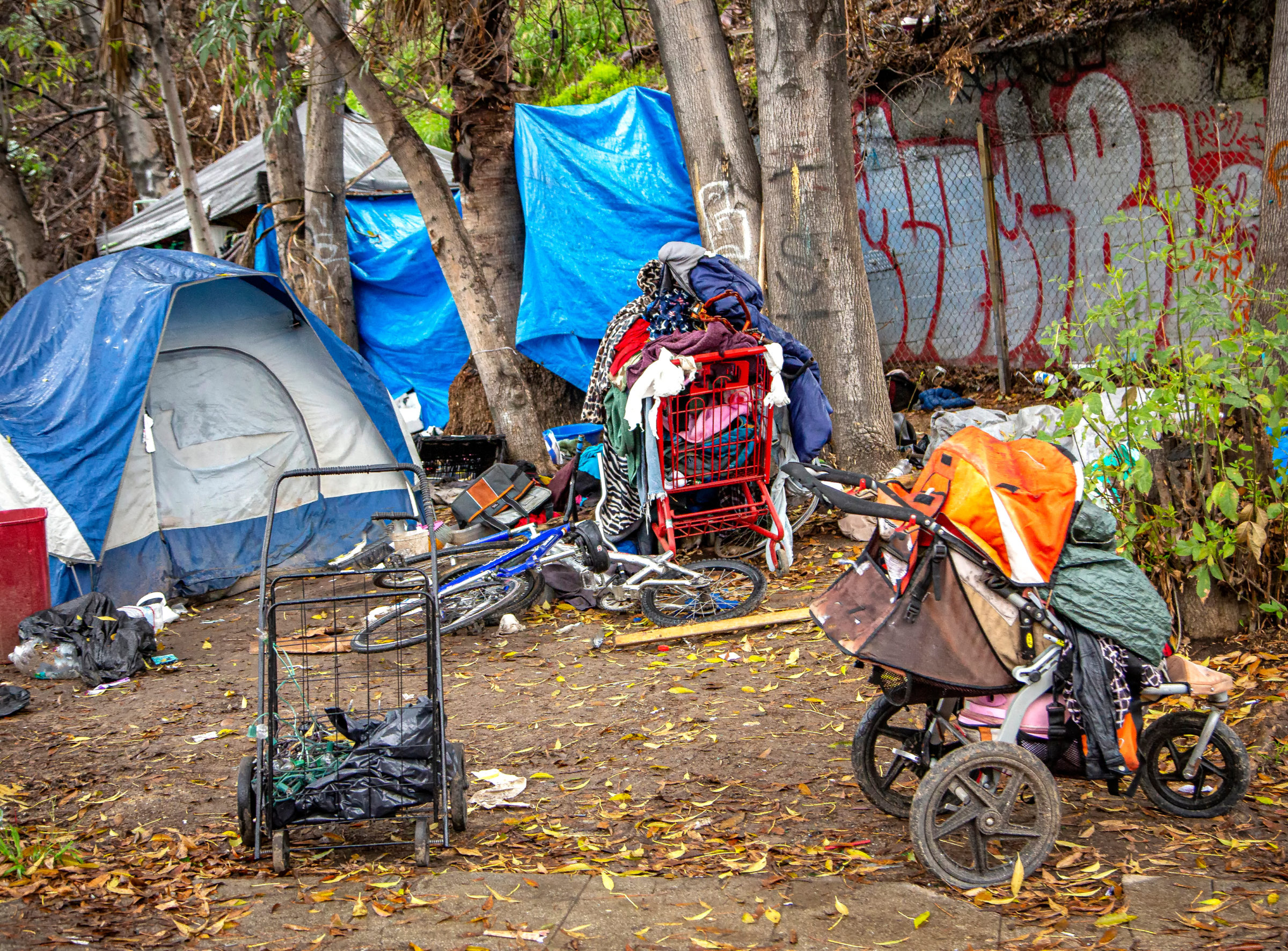 A homeless encampment on the side of a road