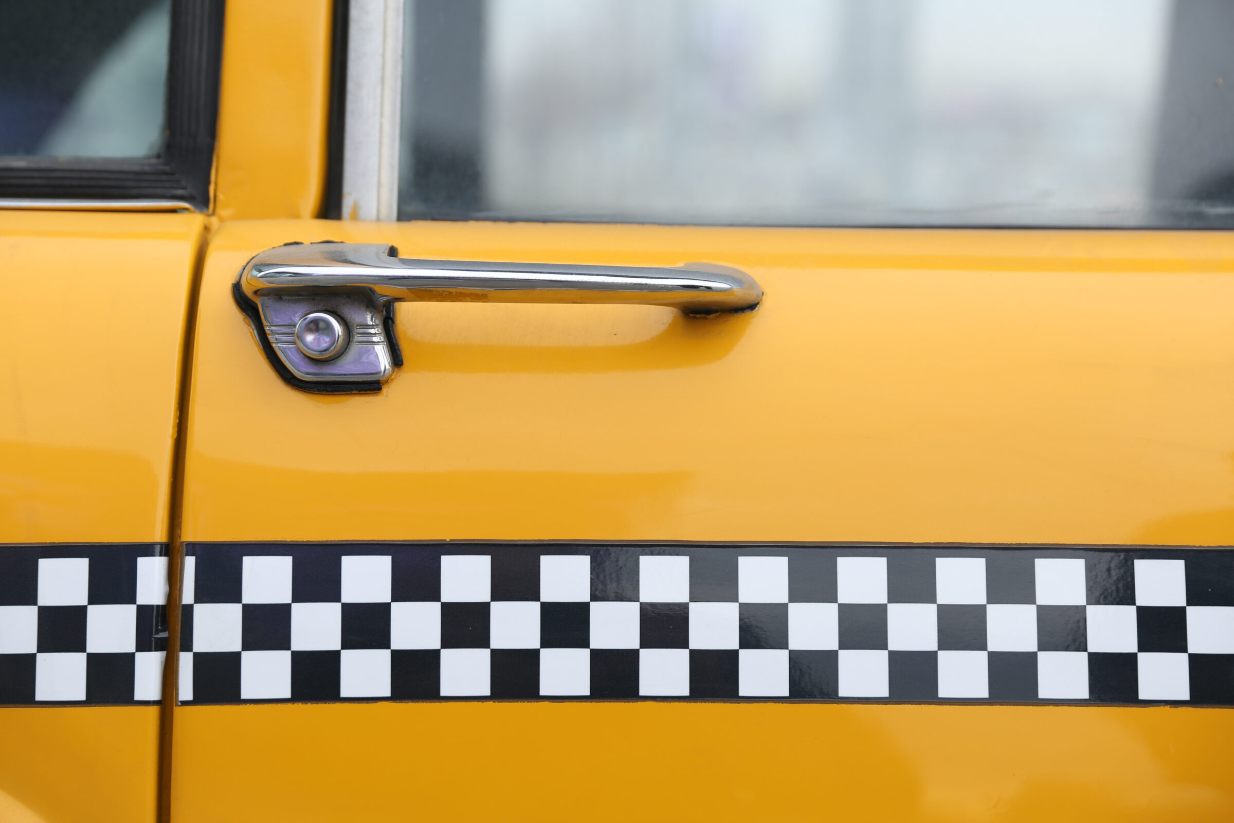 door handle of an old american taxi close up. door of the vintage cab from New York