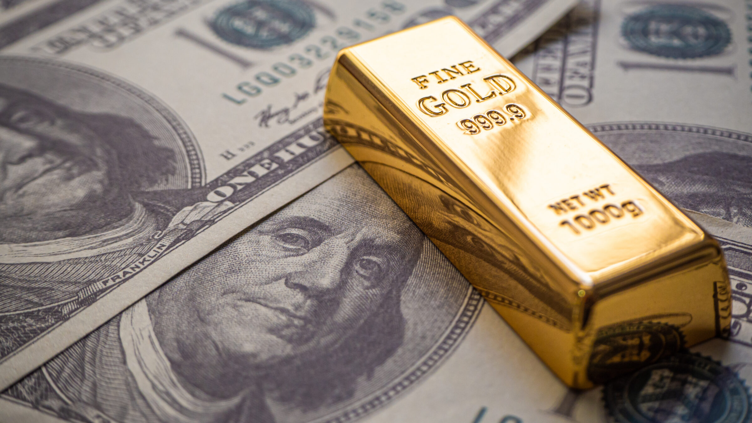 gold bar overlay money dollars, Concept In a poor economy Investors should hold dollar or gold.