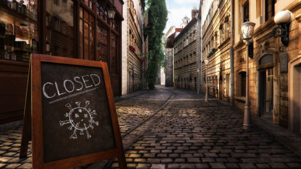 Coronavirus crisis. CLOSED message board near bar, cafe, shop on empty street. Corona virus COVID-19 flu disease global pandemic outbreak, business impact, isolation, quarantine, stay at home concept