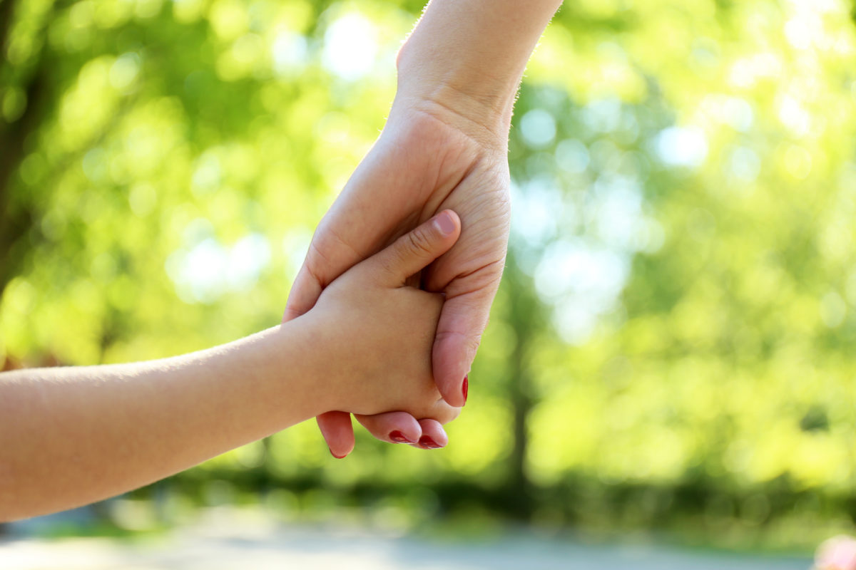 Mom and daughter hands, outdoors