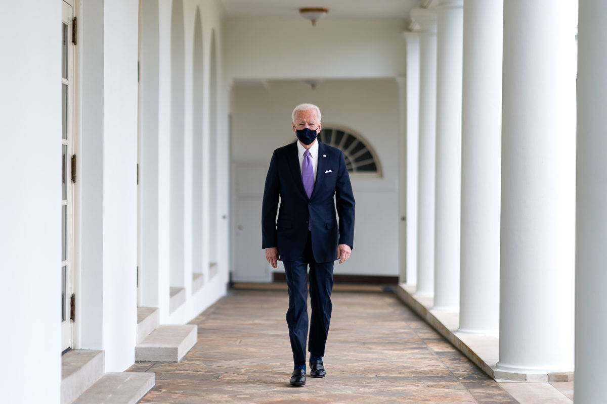 President Joe Biden walks along the Colonnade Thursday, Jan. 21, 2021, to the Oval Office of the White House.