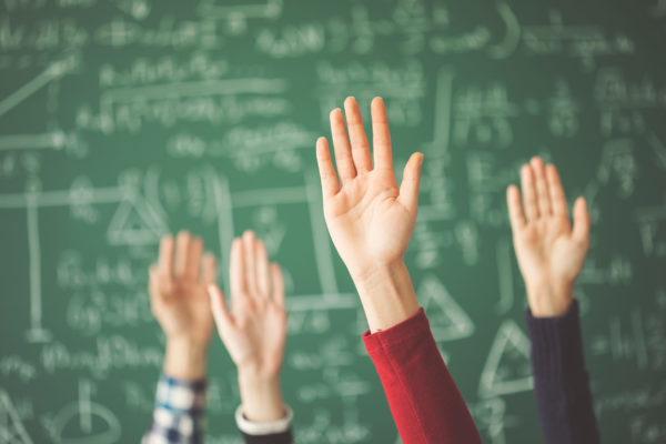 Students raising hands
