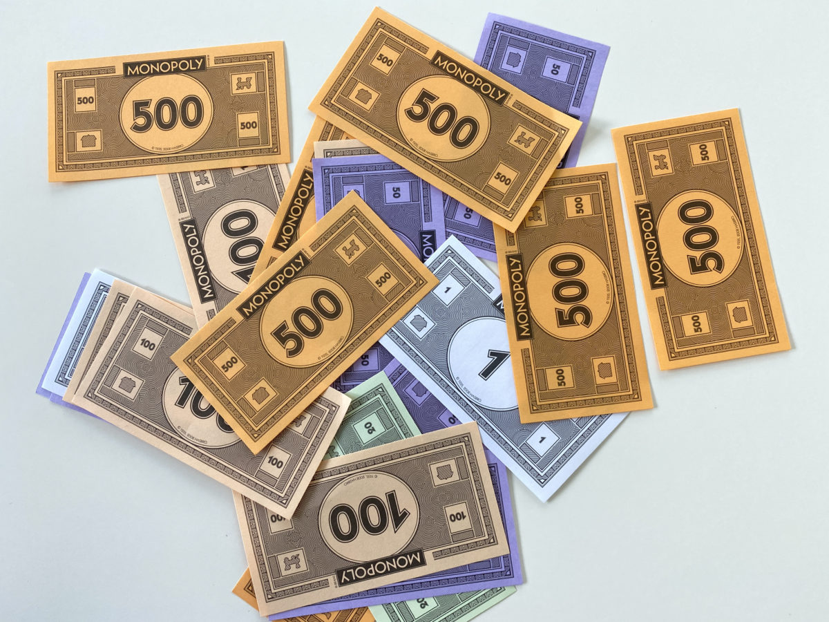 Money for the game Monopoly by Hasbro on a white background.