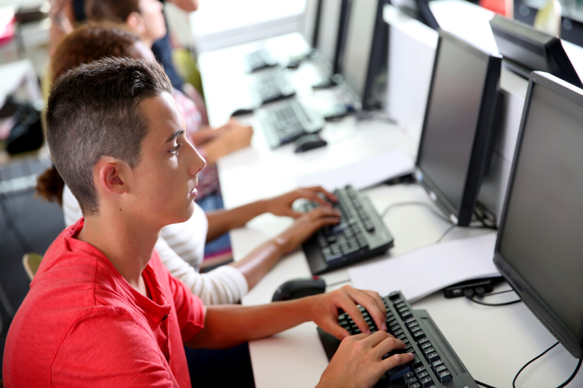 Group of young people in computing class
