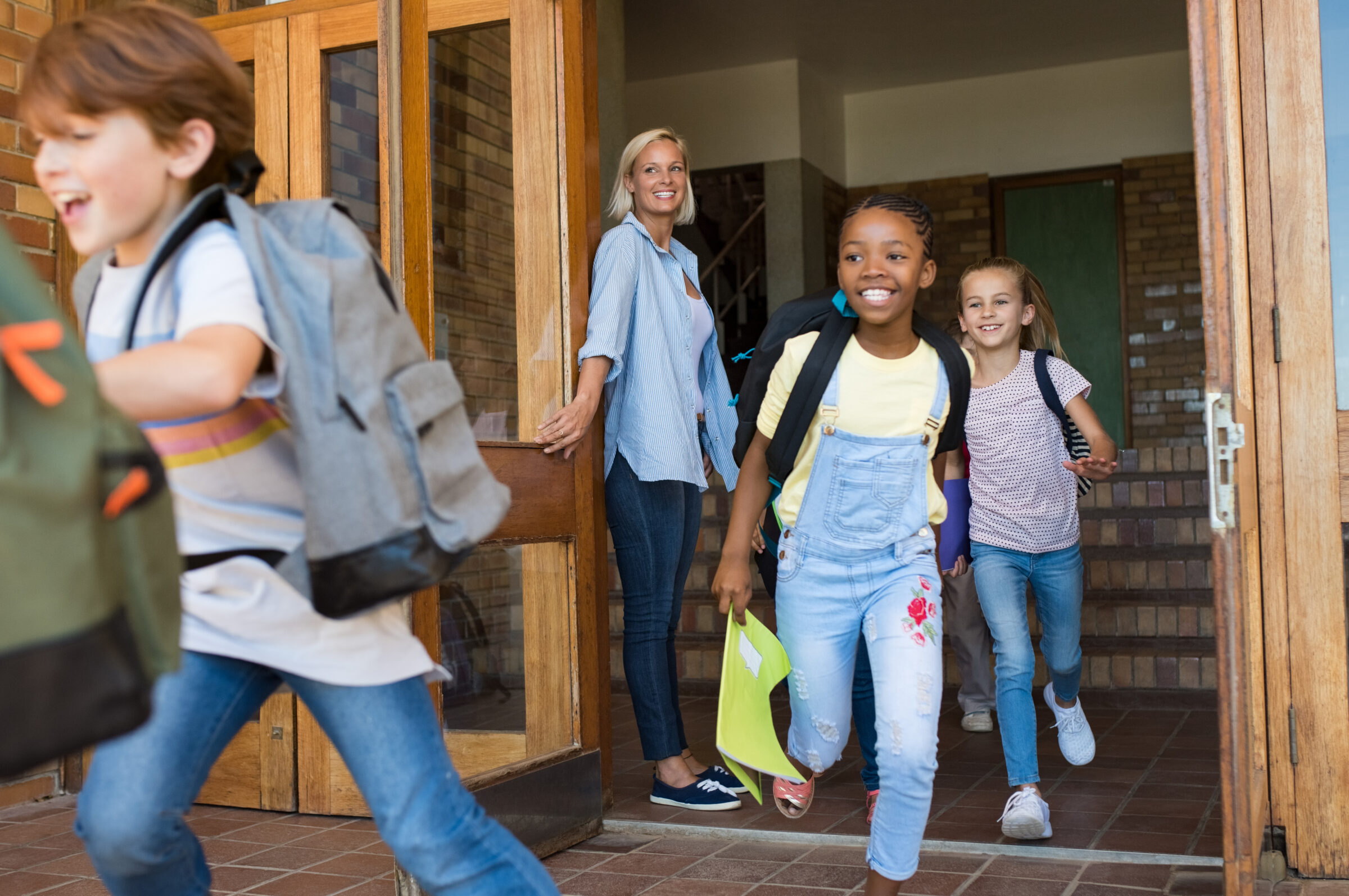 Children running outside school