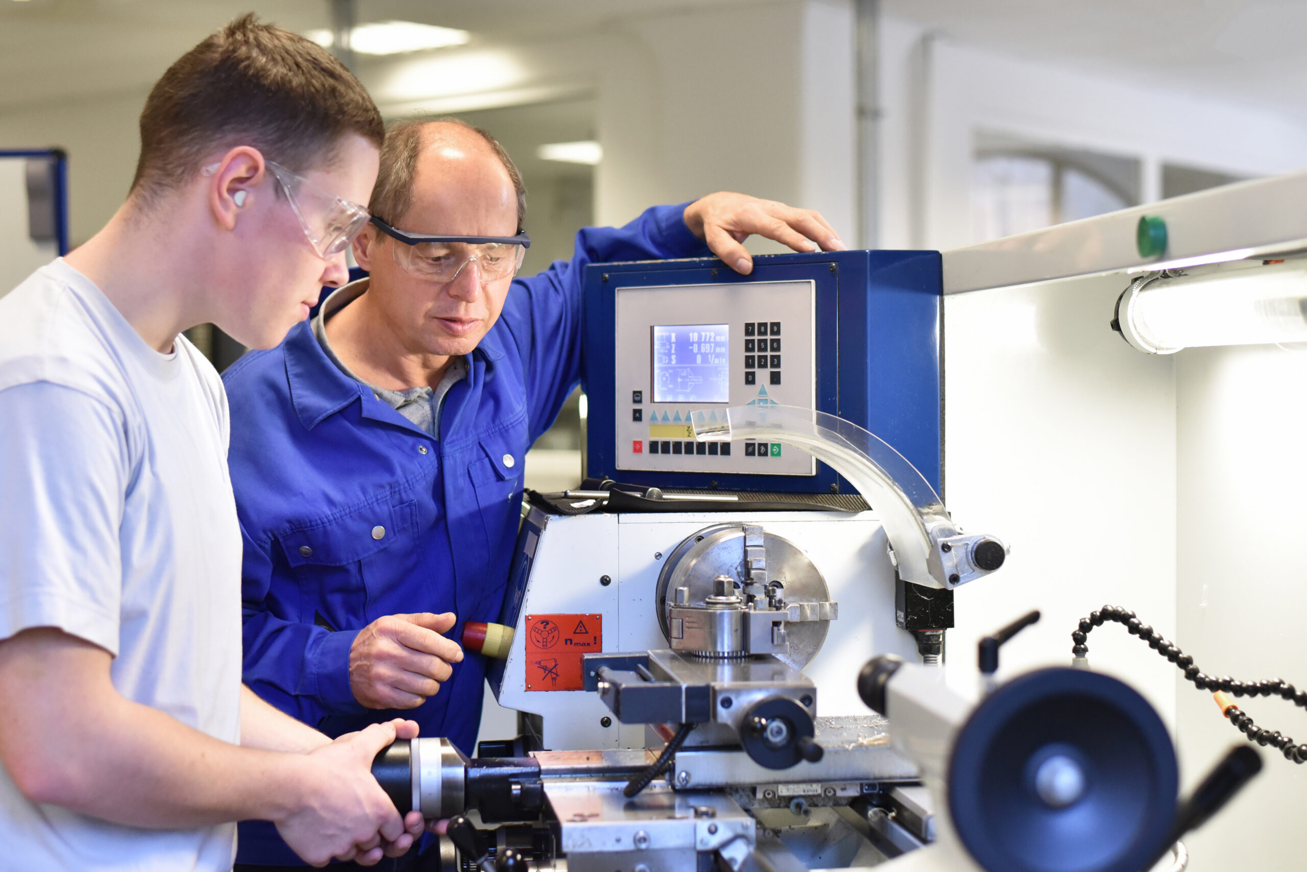 Group of young people in technical vocational training with teacher