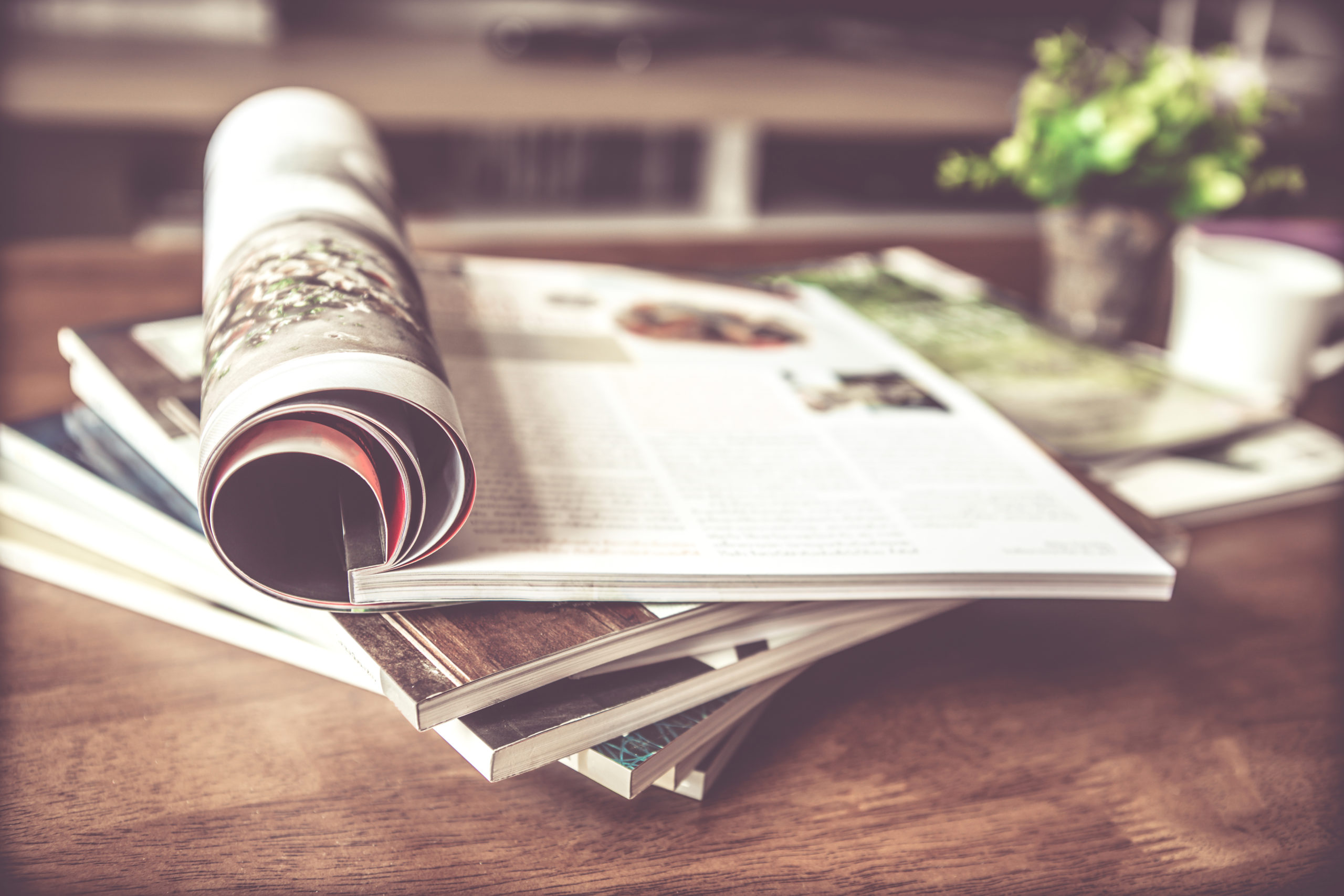 selective focus of stacking magazine place on table in living room